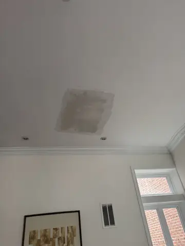 Ceiling access panel repair in a finished room