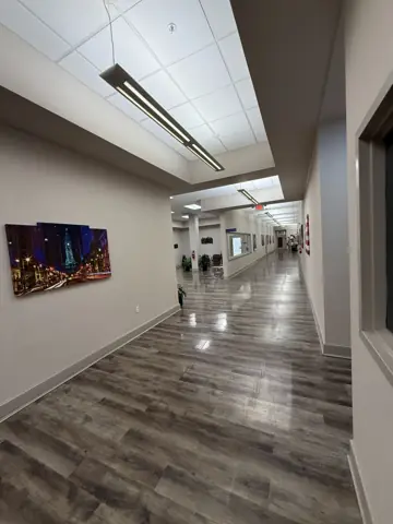 Commercial hallway with new flooring and wall panels