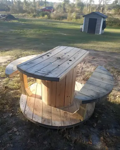 Custom outdoor table built from a wooden cable spool