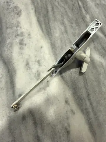 Door latch and hardware ready to install on a marble surface
