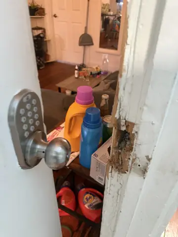 Door with a keypad lock being repaired