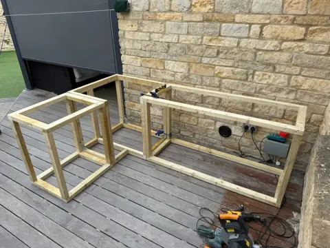 Framing an outdoor kitchen island on a deck