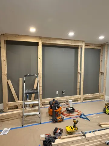 New wall framing and drywall prep in a renovation