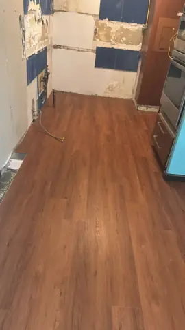 New wood-look flooring installed in a hallway