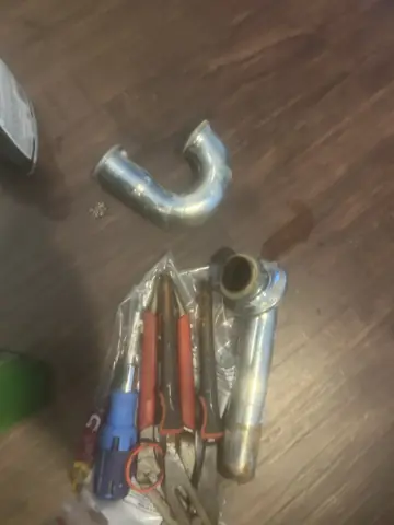 Old corroded copper and drain pipes removed during a plumbing repair