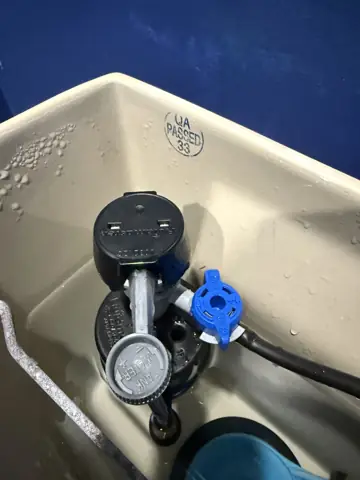 Toilet tank fill valve replaced during a plumbing repair